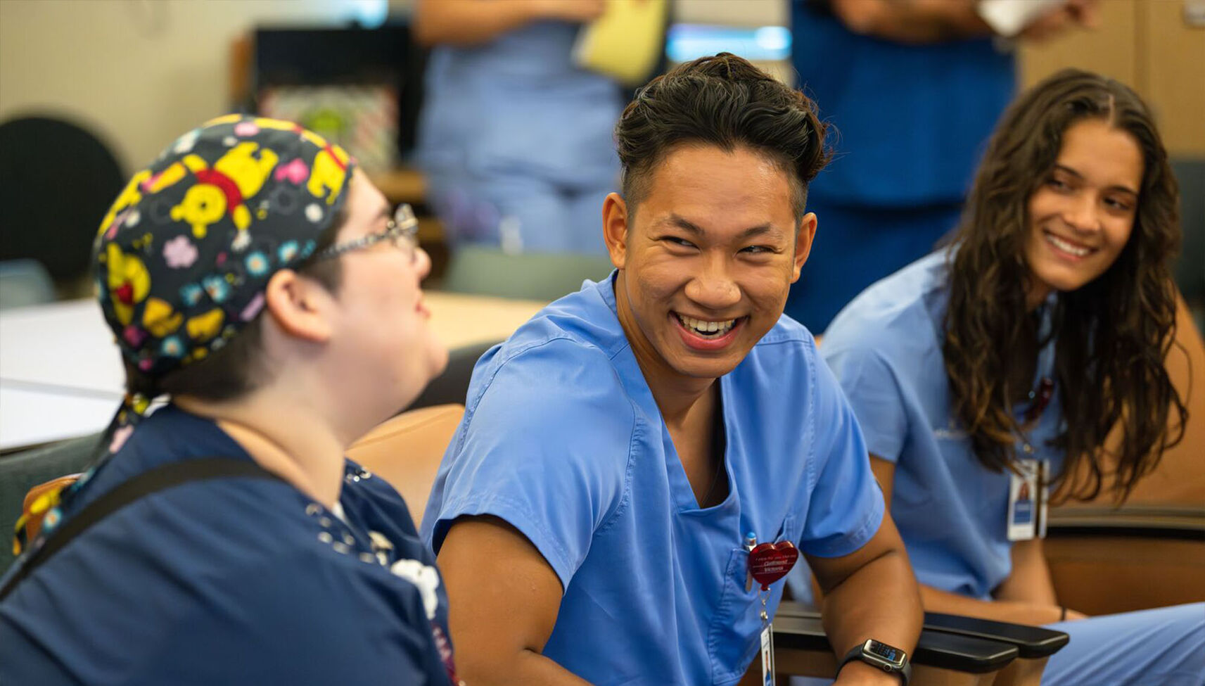 Nursing interns conversing with each other