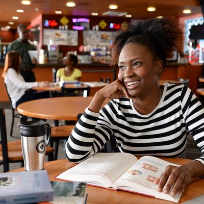 Woman at cafe studying
